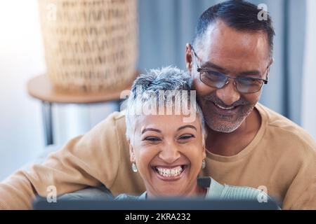 Senior couple, happy and laptop while online streaming movie, show or comic video and laughing at meme using home wifi on social media. Face of man Stock Photo