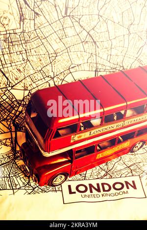 Travel and tourism scene on a vehicle navigating around maps of urban city London. The famous red bus Stock Photo