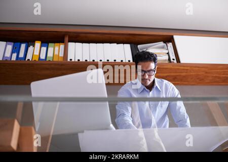 Hes ready for whatever the business world throws at him. a handsome young businessman in his office. Stock Photo