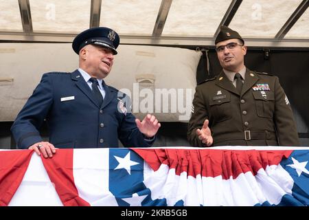 Oregon National Guard Brig. Gen. Mark Crosby, Assistant Adjutant General for Air, and Oregon Army National Guard Sgt. Nathan Flores, enjoy the 71st Annual Linn County Veterans Day Parade from the observation platform at Albany, Oregon on Nov. 11, 2022. The event is recognized as one of the largest Veterans Day parades in the United States each year. (National Guard photo by John Hughel, Oregon Military Department Public Affairs) Stock Photo