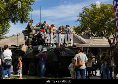 U.S. Marines with 1st Light Armored Reconnaissance Battalion, 1st Marine Division, show civilians a LAV-25 Light Armored Vehicle at Ladera Ranch, California, Nov. 11, 2022. The Marines set up a static display with vehicles as part of the Ladera Ranch Veterans Day ceremony. Stock Photo