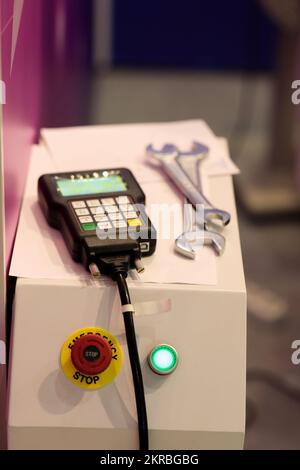 Handheld pendant remote control of CNC machine. Selective focus. Stock Photo