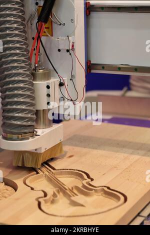 Milling process with woodworking CNC machine. Selective focus. Stock Photo