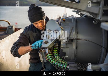 221113-N-GF955-1015  PLYMOUTH, United Kingdom (Nov. 13, 2022) U.S. Navy Fire Controlman 2nd Class Timothy Anderson, from Richmond, Kentucky, conducts preventative maintenance on a Phalanx close-in weapons system (CIWS) aboard the Arleigh Burke-class guided-missile destroyer USS Paul Ignatius (DDG 117), Nov. 13, 2022. Paul Ignatius, forward-deployed to Rota, Spain, is on a scheduled deployment in the U.S. Naval Forces Europe area of operations, employed by U.S. Sixth Fleet, to defend U.S., allied and partner interests. Stock Photo