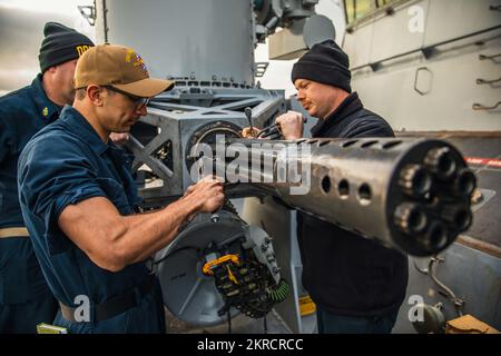 221113-N-GF955-1071  PLYMOUTH, United Kingdom (Nov. 13, 2022) U.S. Navy Sailors assigned to the Arleigh Burke-class guided-missile destroyer USS Paul Ignatius (DDG 117) conduct preventative maintenance on a Phalanx close-in weapons system (CIWS), Nov. 13, 2022. Paul Ignatius, forward-deployed to Rota, Spain, is on a scheduled deployment in the U.S. Naval Forces Europe area of operations, employed by U.S. Sixth Fleet, to defend U.S., allied and partner interests. Stock Photo