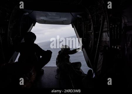 U.S. Marines with Marine Medium Tiltrotor Squadron (VMM) 265 scan the horizon during exercise Keen Sword 23 off the coast Kumamoto, Japan, Nov. 14, 2022.  Keen Sword exercises the combined capabilities and lethality developed between the 1st Marine Aircraft Wing, III Marine Expeditionary Force, and the Japan Self Defense Force (JSDF). This bilateral field-training exercise between the U.S. military and JSDF strengthens interoperability and combat readiness of the U.S.-Japan Alliance. Stock Photo