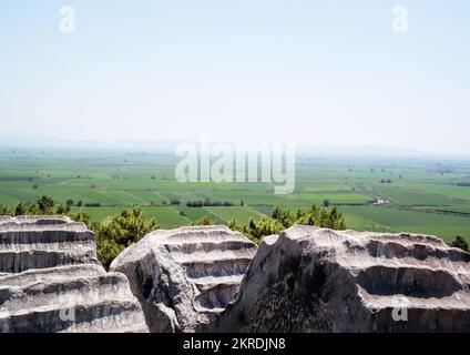 Priene, Söke, Aydın, Turkey, Sep. 2018: Ruins of the ancient city of Priene, Ionic columns of the Temple of Athena Polias in Priene. Stock Photo