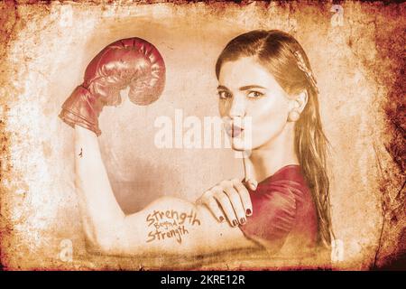 Very vintage photo of beautiful girl fist pumping muscles with text STRENGTH BEYOND STRENGTH tattoo. Far beyond driven poster pinup Stock Photo