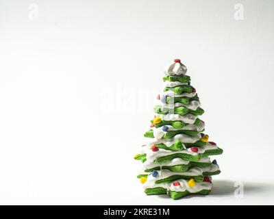 Green cookie christmas tree made by star cookie cutter on white background Stock Photo