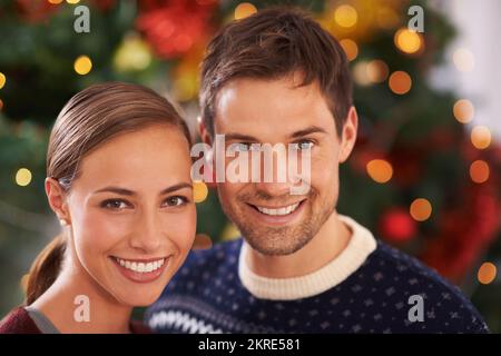 Spending yet another Christmas together. Portrait of an affectionate young couple on Christmas day. Stock Photo