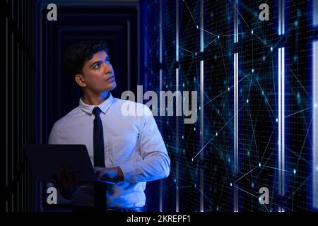 Technician working on the server in the data storage room. Stock Photo
