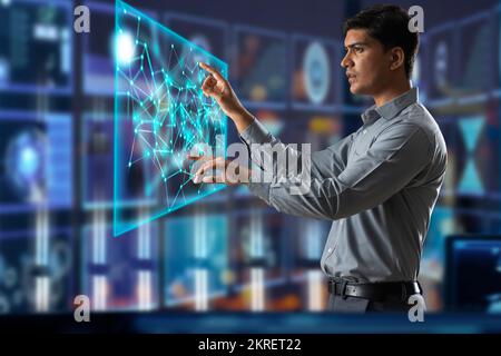 Digitally enhanced shot of a  technician/businessman working with virtual reality projection Stock Photo