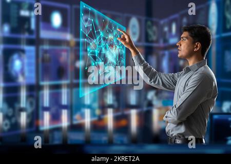 Digitally enhanced shot of a  technician/businessman working with virtual reality projection Stock Photo