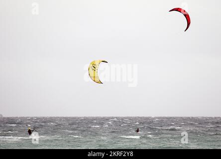 People practising kitesurfing in Playa de Muro, Mallorca, Spain, during ...