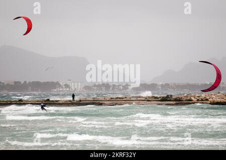 People practising kitesurfing in Playa de Muro, Mallorca, Spain, during ...