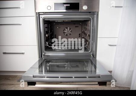 Modern electric oven with telescopic rails, top and bottom heat. Function 3D hot air, thermal grill and convection. Stock Photo