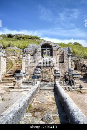 Antalya, Turkey, May 2014: Nymphaeum of Perge. Ruins of ancient Pamphylian city. Statue of Kestros, river god Stock Photo