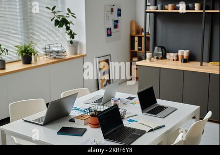 High angle view of modern office of developers with computers on table for online work Stock Photo