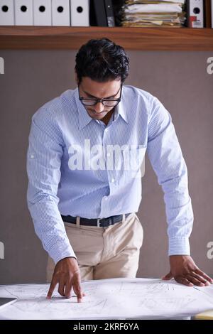 Hes ready for whatever the business world throws at him. a handsome young businessman in his office. Stock Photo