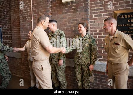 221116-N-SJ665-1038 WASHINGTON. (November 16, 2022) Lieutenant JG David A. Harbuzuik congratulates Musician 1st Class Amy Eich on re-enlisting with the US Navy Band. Stock Photo