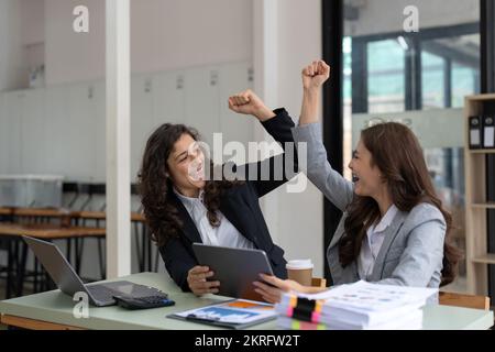 Two happy friendly diverse professionals giving high five standing in ...