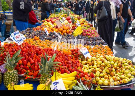 ISTANBUL - OCTOBER 17: Local street market or bazaar with rows of fresh fruits and different kind of food in Istanbul on January 17. 2022 in Turkey Stock Photo