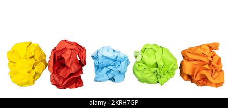 a few sheets of crumpled colored paper on a transparent surface Stock Photo