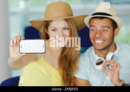 couple tourist taking a selfie in airport before journey Stock Photo