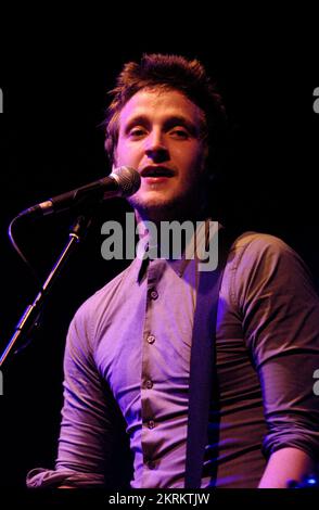 ROSS MILLARD, FUTUREHEADS, YOUNG, 2005: Ross Millard, singer and guitarist of the Futureheads on the NME Tour at Cardiff University, February 6 2005. Photograph: ROB WATKINS.  INFO: The Futureheads are a British rock band formed in 2000 in Sunderland. Known for their energetic, post-punk revival sound and catchy melodies, they gained prominence with their self-titled debut album and hits like 'Hounds of Love,' becoming influential in the indie rock scene. Stock Photo