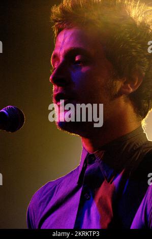 ROSS MILLARD, FUTUREHEADS, YOUNG, 2005: Ross Millard, singer and guitarist of the Futureheads on the NME Tour at Cardiff University, February 6 2005. Photograph: ROB WATKINS.  INFO: The Futureheads are a British rock band formed in 2000 in Sunderland. Known for their energetic, post-punk revival sound and catchy melodies, they gained prominence with their self-titled debut album and hits like 'Hounds of Love,' becoming influential in the indie rock scene. Stock Photo