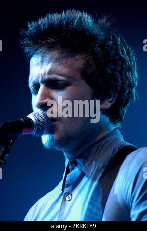 ROSS MILLARD, FUTUREHEADS, YOUNG, 2005: Ross Millard, singer and guitarist of the Futureheads on the NME Tour at Cardiff University, February 6 2005. Photograph: ROB WATKINS.  INFO: The Futureheads are a British rock band formed in 2000 in Sunderland. Known for their energetic, post-punk revival sound and catchy melodies, they gained prominence with their self-titled debut album and hits like 'Hounds of Love,' becoming influential in the indie rock scene. Stock Photo