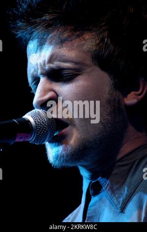 ROSS MILLARD, FUTUREHEADS, YOUNG, 2005: Ross Millard, singer and guitarist of the Futureheads on the NME Tour at Cardiff University, February 6 2005. Photograph: ROB WATKINS.  INFO: The Futureheads are a British rock band formed in 2000 in Sunderland. Known for their energetic, post-punk revival sound and catchy melodies, they gained prominence with their self-titled debut album and hits like 'Hounds of Love,' becoming influential in the indie rock scene. Stock Photo