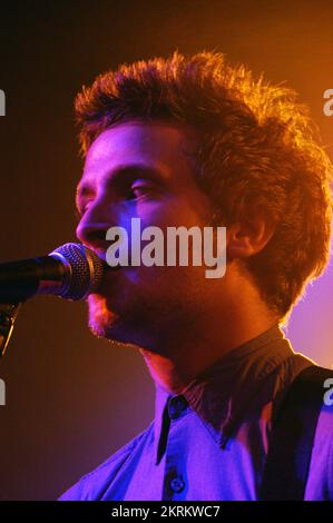 ROSS MILLARD, FUTUREHEADS, YOUNG, 2005: Ross Millard, singer and guitarist of the Futureheads on the NME Tour at Cardiff University, February 6 2005. Photograph: ROB WATKINS.  INFO: The Futureheads are a British rock band formed in 2000 in Sunderland. Known for their energetic, post-punk revival sound and catchy melodies, they gained prominence with their self-titled debut album and hits like 'Hounds of Love,' becoming influential in the indie rock scene. Stock Photo