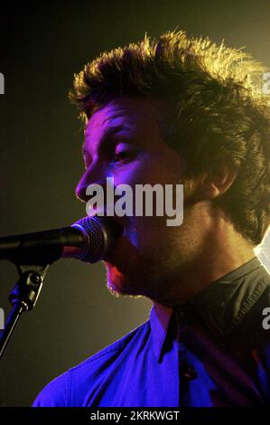 ROSS MILLARD, FUTUREHEADS, YOUNG, 2005: Ross Millard, singer and guitarist of the Futureheads on the NME Tour at Cardiff University, February 6 2005. Photograph: ROB WATKINS.  INFO: The Futureheads are a British rock band formed in 2000 in Sunderland. Known for their energetic, post-punk revival sound and catchy melodies, they gained prominence with their self-titled debut album and hits like 'Hounds of Love,' becoming influential in the indie rock scene. Stock Photo