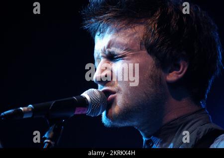 ROSS MILLARD, FUTUREHEADS, YOUNG, 2005: Ross Millard, singer and guitarist of the Futureheads on the NME Tour at Cardiff University, February 6 2005. Photograph: ROB WATKINS.  INFO: The Futureheads are a British rock band formed in 2000 in Sunderland. Known for their energetic, post-punk revival sound and catchy melodies, they gained prominence with their self-titled debut album and hits like 'Hounds of Love,' becoming influential in the indie rock scene. Stock Photo