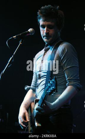 ROSS MILLARD, FUTUREHEADS, YOUNG, 2005: Ross Millard, singer and guitarist of the Futureheads on the NME Tour at Cardiff University, February 6 2005. Photograph: ROB WATKINS.  INFO: The Futureheads are a British rock band formed in 2000 in Sunderland. Known for their energetic, post-punk revival sound and catchy melodies, they gained prominence with their self-titled debut album and hits like 'Hounds of Love,' becoming influential in the indie rock scene. Stock Photo