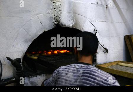 A traditional fire oven bakery specializing in Ka’ek Al-Quds - Sesame bagel bread. Christian quarter, Old city of Jerusalem. Stock Photo