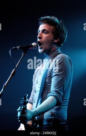 ROSS MILLARD, FUTUREHEADS, YOUNG, 2005: Ross Millard, singer and guitarist of the Futureheads on the NME Tour at Cardiff University, February 6 2005. Photograph: ROB WATKINS.  INFO: The Futureheads are a British rock band formed in 2000 in Sunderland. Known for their energetic, post-punk revival sound and catchy melodies, they gained prominence with their self-titled debut album and hits like 'Hounds of Love,' becoming influential in the indie rock scene. Stock Photo