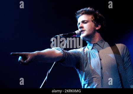 ROSS MILLARD, FUTUREHEADS, YOUNG, 2005: Ross Millard, singer and guitarist of the Futureheads on the NME Tour at Cardiff University, February 6 2005. Photograph: ROB WATKINS.  INFO: The Futureheads are a British rock band formed in 2000 in Sunderland. Known for their energetic, post-punk revival sound and catchy melodies, they gained prominence with their self-titled debut album and hits like 'Hounds of Love,' becoming influential in the indie rock scene. Stock Photo