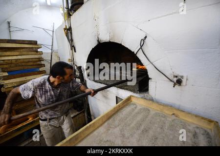 A traditional fire oven bakery specializing in Ka’ek Al-Quds - Sesame bagel bread. Christian quarter, Old city of Jerusalem. Stock Photo