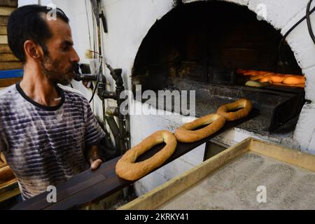 A traditional fire oven bakery specializing in Ka’ek Al-Quds - Sesame bagel bread. Christian quarter, Old city of Jerusalem. Stock Photo