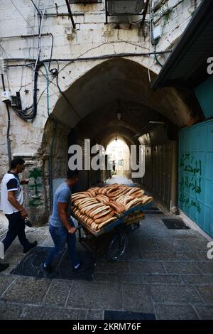 Fresh Ka’ek Al-Quds - Sesame bagel bread being delivered on a traditional cart to various shops in the Old city of Jerusalem. Stock Photo