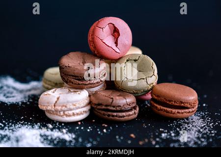 Close up of colored cookies on black background Stock Photo