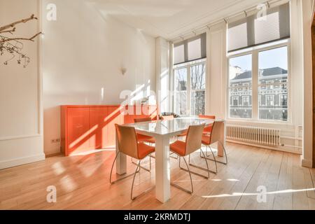 Bright empty conference room with table and chairs Stock Photo