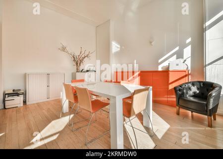Bright empty conference room with table and chairs Stock Photo