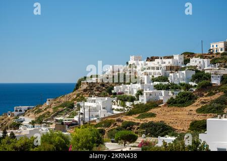 Ios, Greece - September 9, 2022 : View of beautiful whitewashed hotel rooms and restaurants  overlooking the Aegean Sea in Mylopotas Ios Greece Stock Photo