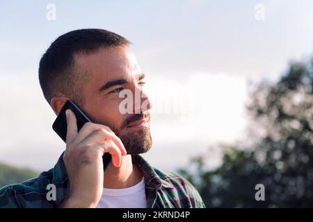 young man talking on mobile phone Stock Photo