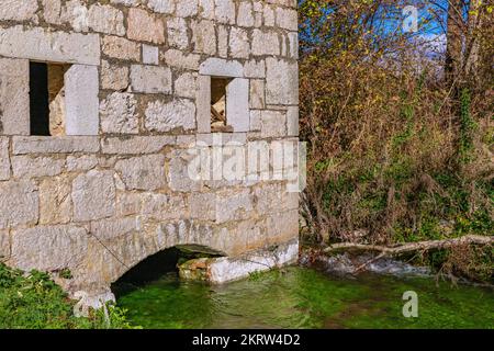 Old stone mill on Cetina river source in Croatia Stock Photo