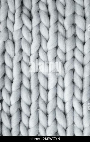 Close up above view of grey soft wool knitted wool background. Stock Photo