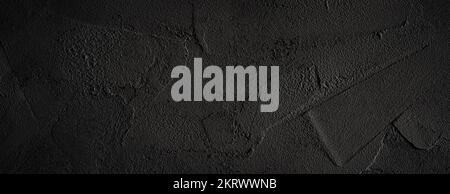 Black or dark gray rough grainy stone wall texture background Stock Photo